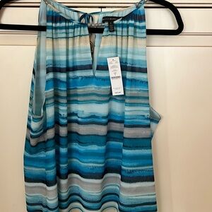 Beautiful blue mirage sleeveless top with tags.